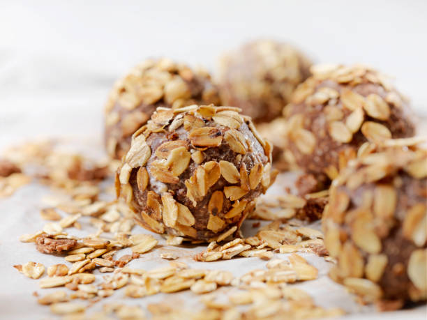 Cocoa Energy Bites with Toasted Oats and Almond Butter Cocoa Energy Bites with Toasted Oats and Almond Butter plasma ball stock pictures, royalty-free photos & images
