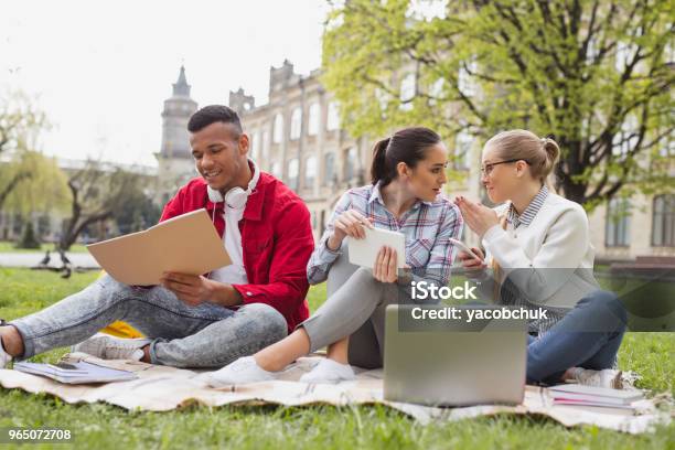 Exchange Students Chatting With Each Other Spending Free Time Together Stock Photo - Download Image Now