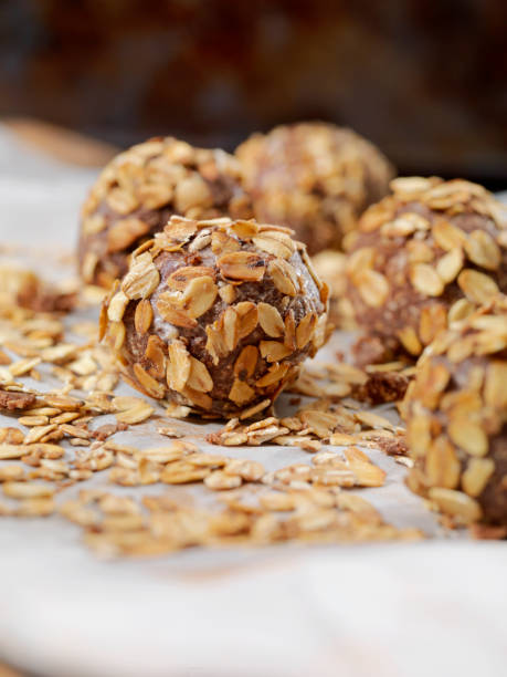 Cocoa Energy Bites with Toasted Oats and Almond Butter Cocoa Energy Bites with Toasted Oats and Almond Butter plasma ball stock pictures, royalty-free photos & images