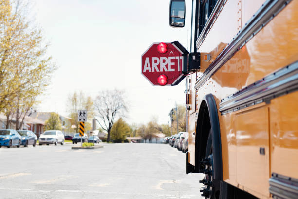istock Yellow School bus with stop sign 965072992
