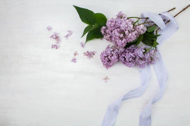 istock The beautiful lilac on a bright wooden background 965076940