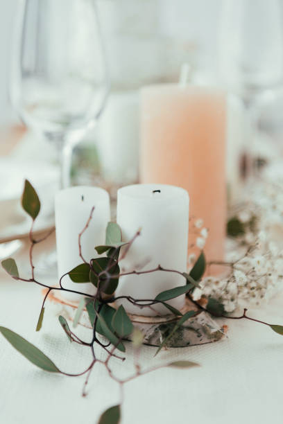 istock close up view of stylish table setting with candles, flowers and eucalyptus for rustic wedding 965108012
