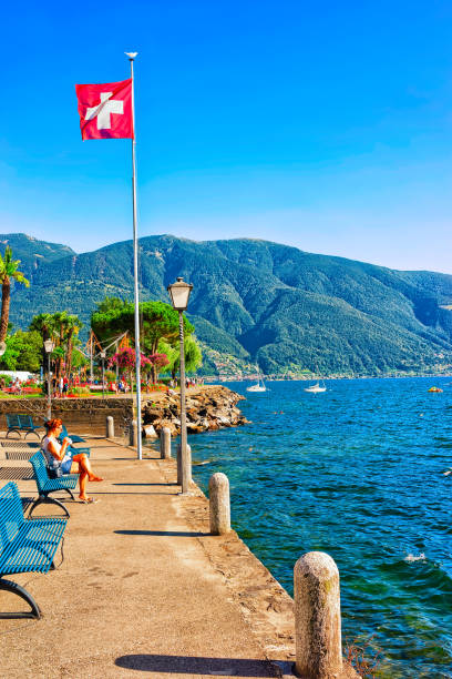 Ascona, Switzerland - August 23, 2016: Swiss flag at the luxurious resort in Ascona on Lake Maggiore in Ticino canton in Switzerland.