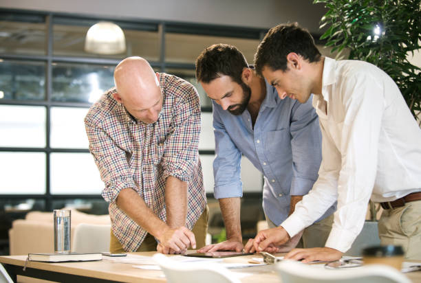 istock Three men meeting to discuss business 965116840