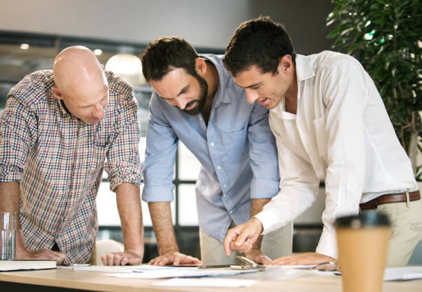 istock Three men meeting to discuss business 965117256