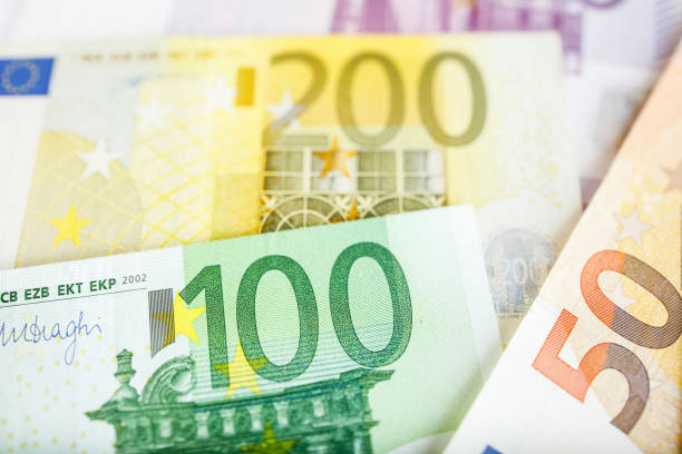 istock Background of euro bills. Shallow focus. 965117556