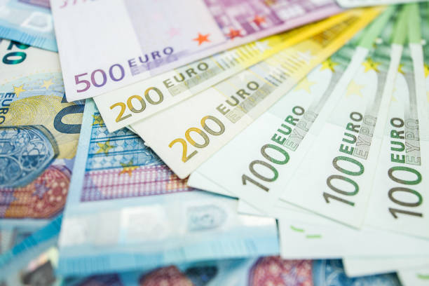istock Background of euro bills. Shallow focus. 965117574