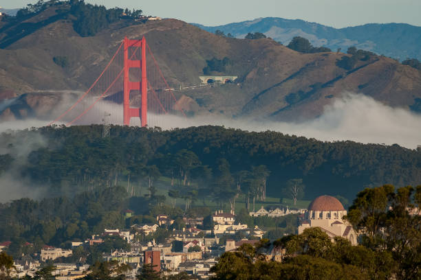 Fog on the Golden Gate bridge A foggy morning at the Golden Gate bridge with the MacArthur tunnel in the background. san francisco county city california urban scene stock pictures, royalty-free photos & images