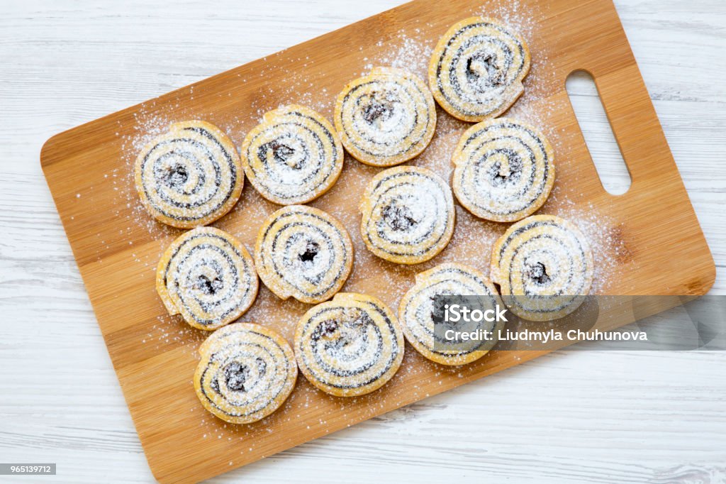 Top view, freshly baked cookies on a bamboo board on white wooden background. Close-up. From above. Above Stock Photo