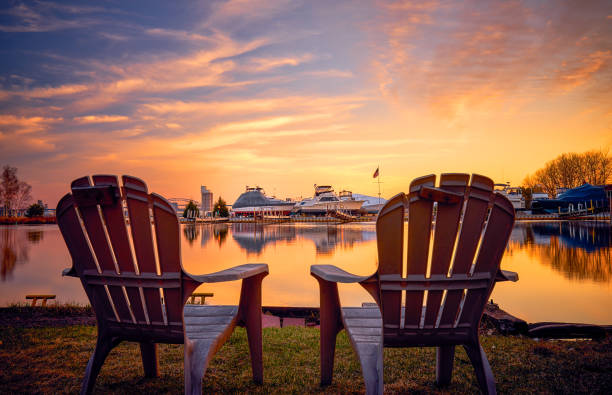 Enjoying Beautiful Sunset at Park Point, Duluth, MN Relaxing feel with two chairs on the bay side of the Park Point, Duluth, MN minnesota stock pictures, royalty-free photos & images