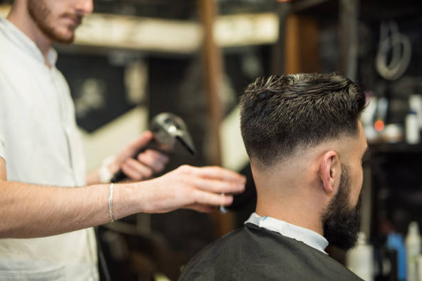 istock Young man getting cleaned up after getting a great haircut. 965161822