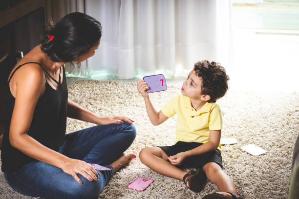 istock Mother and son sitting on the floor playing. 965199142