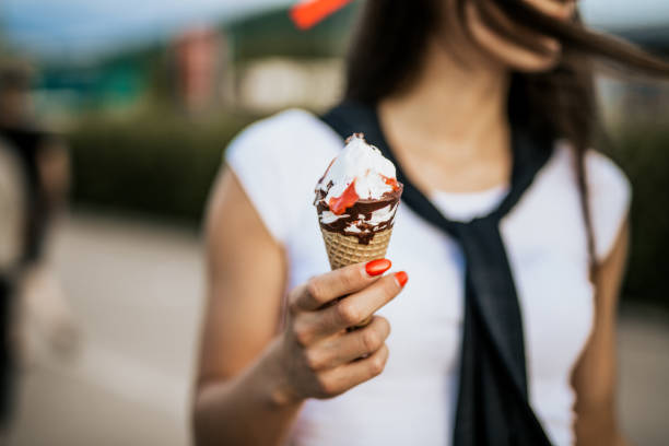 istock Young woman eating her favorite ice cream 965210166