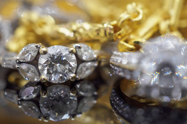 istock Luxury gold Jewelry diamond rings with reflection on black background 965218396