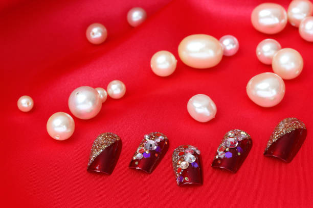 istock nail chips on the red cloth and peal 965228738