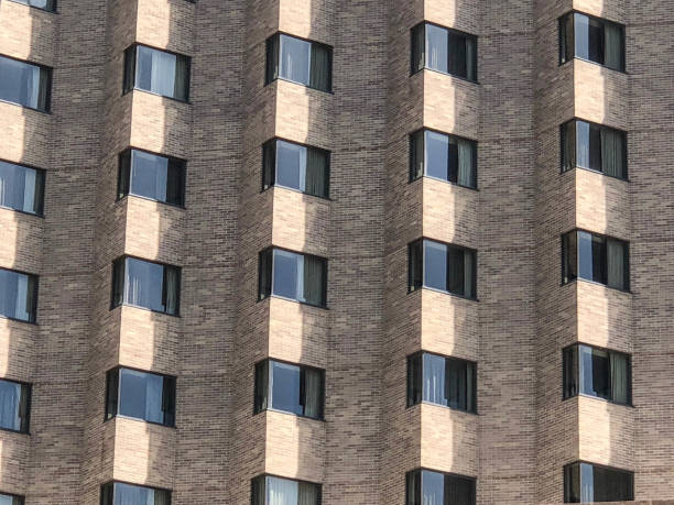 istock Row and columns of windows on brick building 965229024