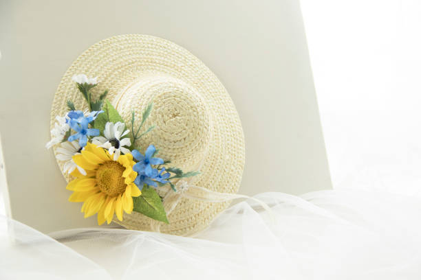 istock straw hat and Sunflower corsage 965231390