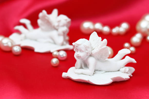 istock angel on the red cloth and peal 965231392