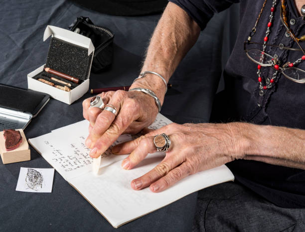 istock Mature woman prepares her notebook for drawing. 965236062