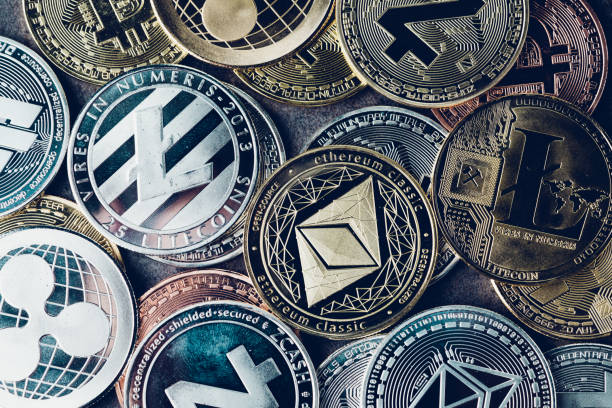 Crypto currency background with various of shiny silver and golden physical cryptocurrencies symbol coins, Bitcoin, Ethereum, Litecoin, zcash, ripple stock photo