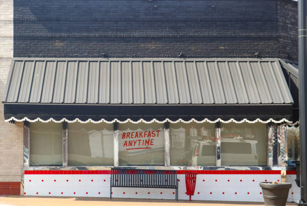 istock Cute retro dinner with canopy with scallops above window reflecting traffic and Breakfast Anytime displayed 965246142