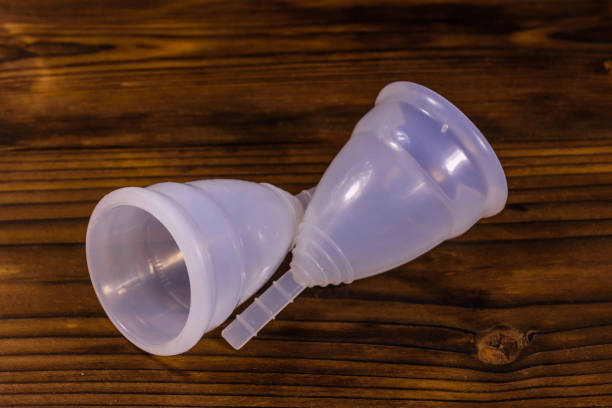 istock Two menstrual cups on a wooden table 965273112