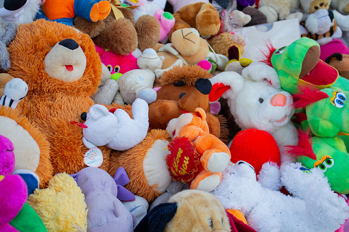Soft children's toys piled in a heap