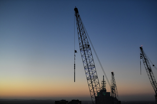 construction crane in melbourne city during dawn