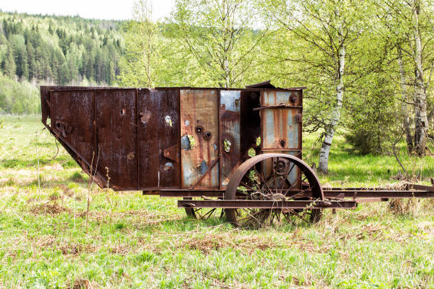 Old rusty agricultural machinery on the field