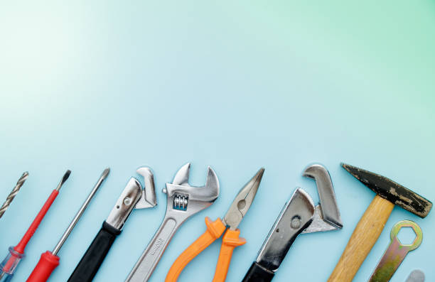 istock Top view of Working tools, wrench, socket wrench, hammer, screwdriver, plier, electric drill, water balance on flat lay background. Fathers day 965325538