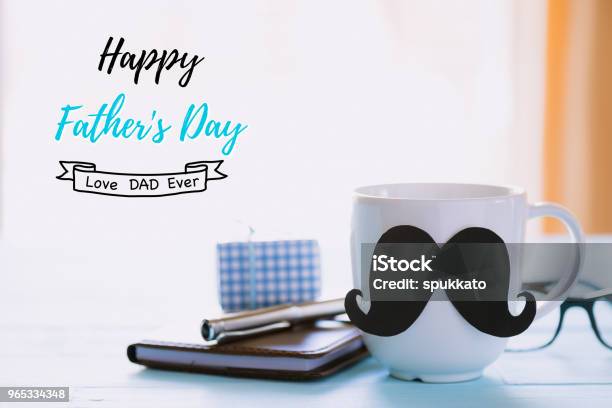 Happy Fathers Day Concept Beautiful Gift Box Glasses Notebook Pen And Coffee Cup With Black Mustache On Wooden Table Background Stock Photo - Download Image Now