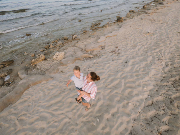 istock Mother and son at the beach 965342858