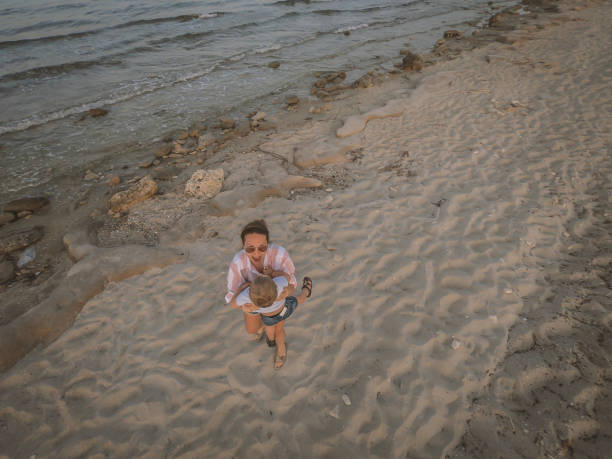istock Mother and son at the beach 965342908
