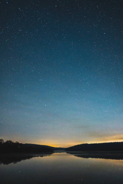 Night sky over rural landscape. stock photo