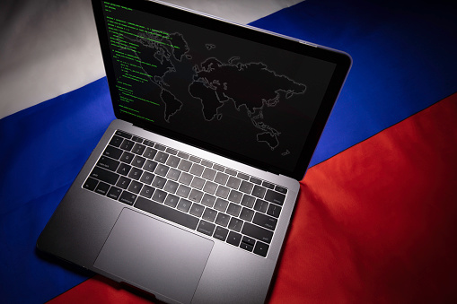Computer on Russian flag +++ text and map on computer was generated by photographer and is copyright free +++