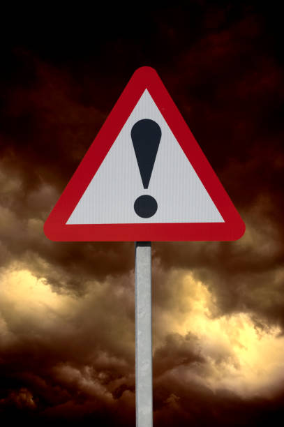 istock ROAD TRAFFIC EXCLAMATION MARK SIGN AND STORMY SKY 965380742