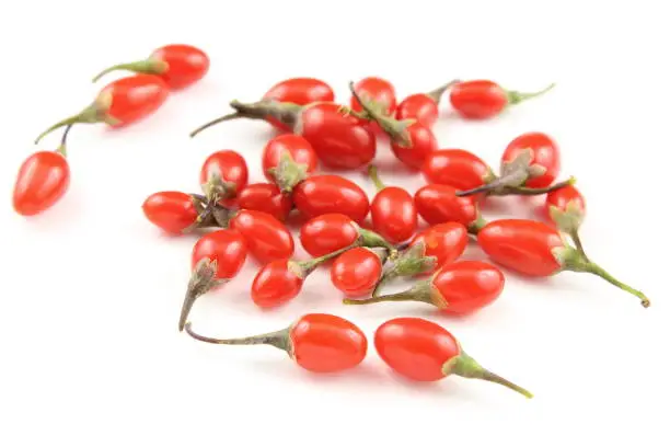 composition of fresh goji berries isolated on a white background