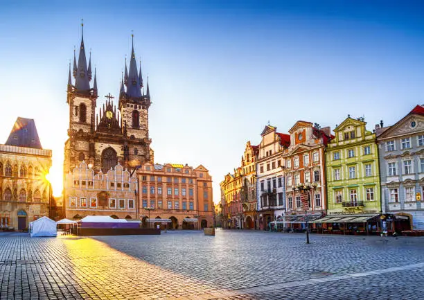 Photo of Old Town Square and Church of Our Lady before Týn in Prague at sunrise. Czech Republic