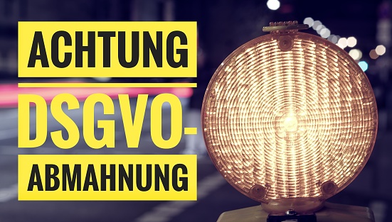 Lamp with in german Achtung DSGVO-Abmahnung in english attention DSGVO (GDPR) warning