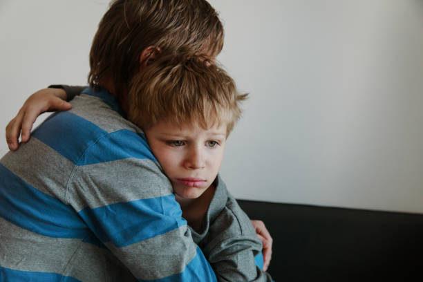 istock Father comforting sad child, parenting, sorrow 965393116