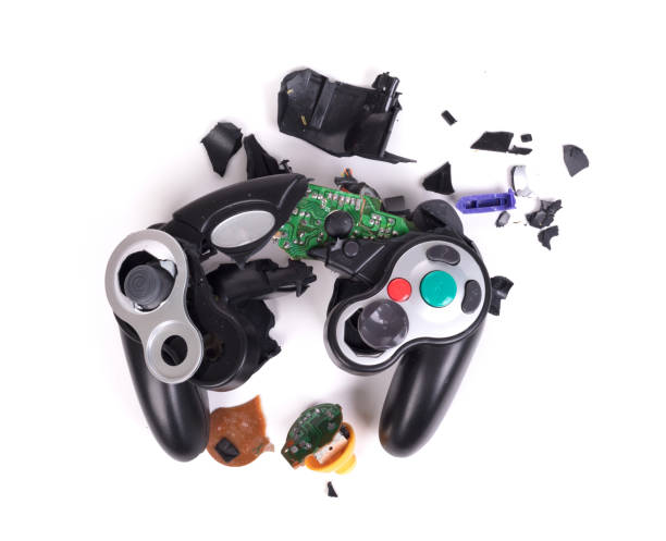 Broken video game controller on white background stock photo