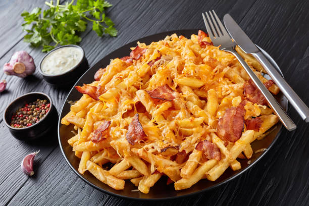 istock Crispy french fries smothered in melted cheese 965396988