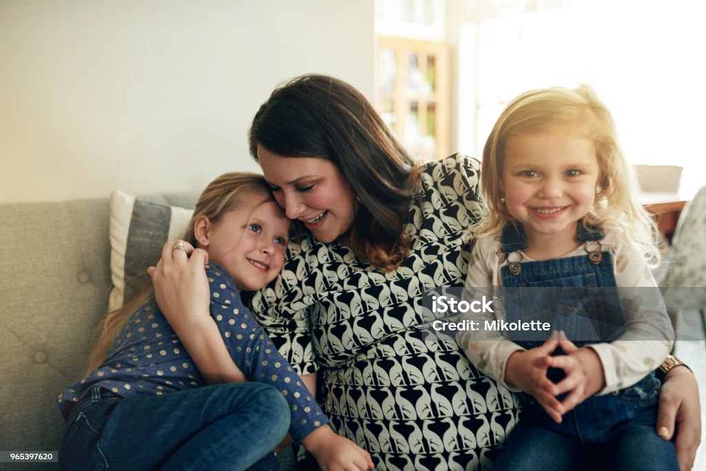 The best moments are spent with Mom Shot of a mother and her little girl spending time together at home Adult Stock Photo