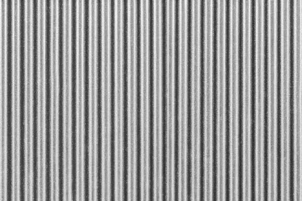 White corrugated metal fence background.