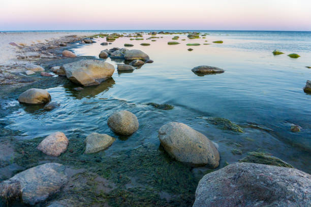 Idyllic Baltic sea with rocks in Bornholm, Denmark on a day in summer stock photo