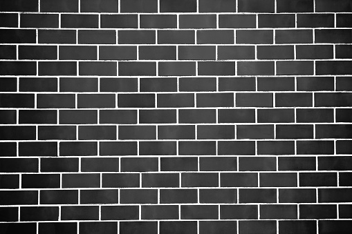 New perfectly black brick wall background. Best clean grey brick wall. Close up. Front view.