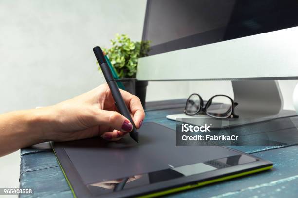 Hand Of Graphic Designer Working With Stilus And Tablet Stock Photo - Download Image Now