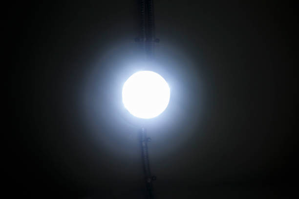 istock glowing lamp with halo isolated on the ceiling 965408612