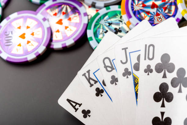 istock poker chips and cards on black background 965409046