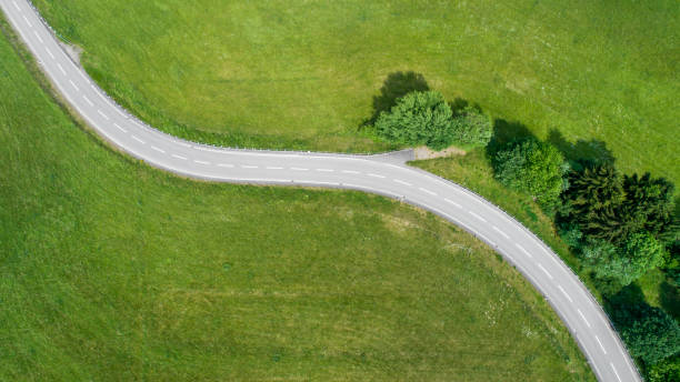 istock Winding road and car 965417116